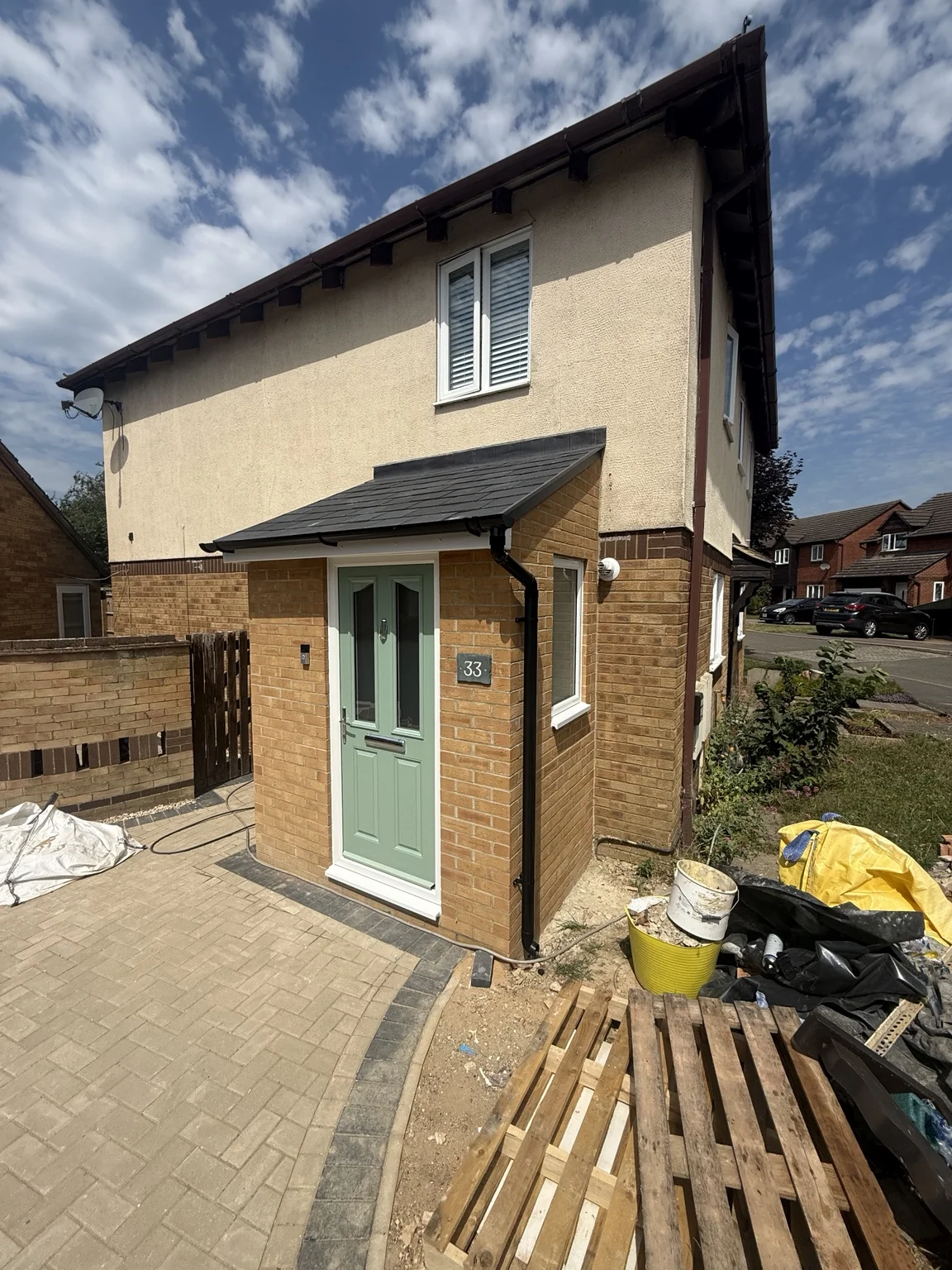 Wider view of the front entrance and canopy