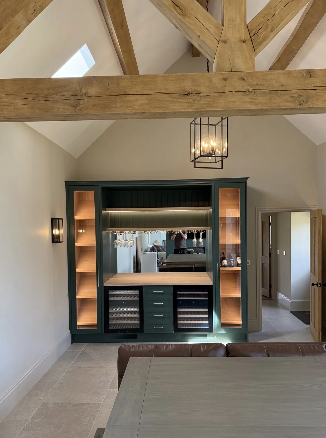 Home bar beneath exposed timber beams